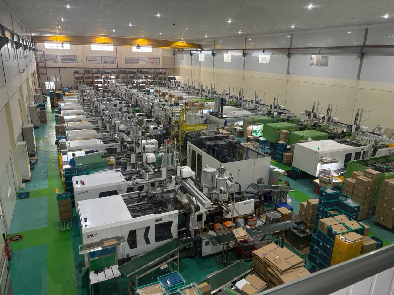 Panoramic view of Vietnam injection molding factory floor with rows of machines